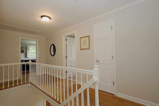 33 Preston Rd, Trumbull, CT 06611 - hallway with an upstairs landing, attic access, wood finished floors, ornamental molding, and baseboards