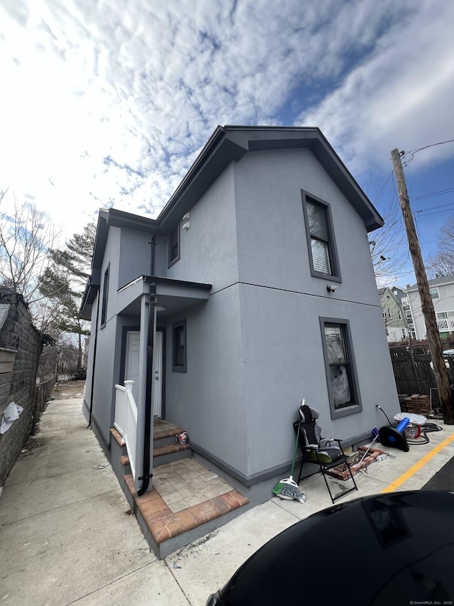 49 Hill St, Waterbury, CT 06704 - rear view of house with stucco siding
