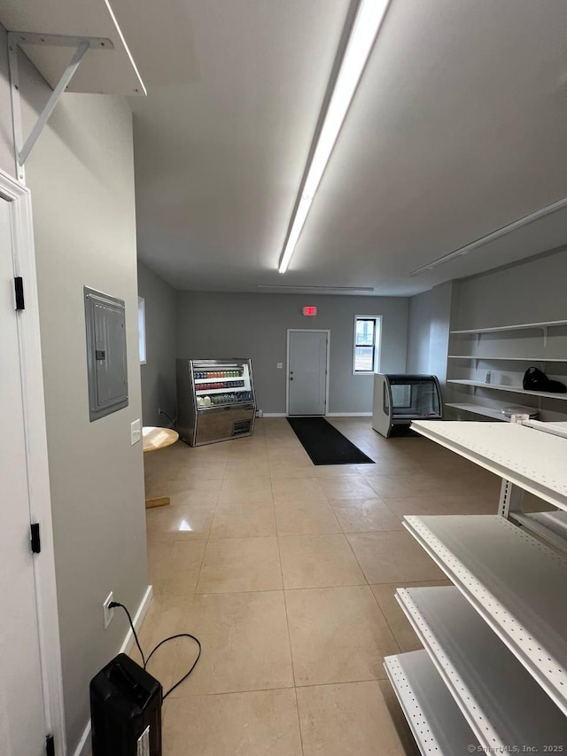 49 Hill St, Waterbury, CT 06704 - miscellaneous room featuring electric panel, light tile patterned floors, and baseboards