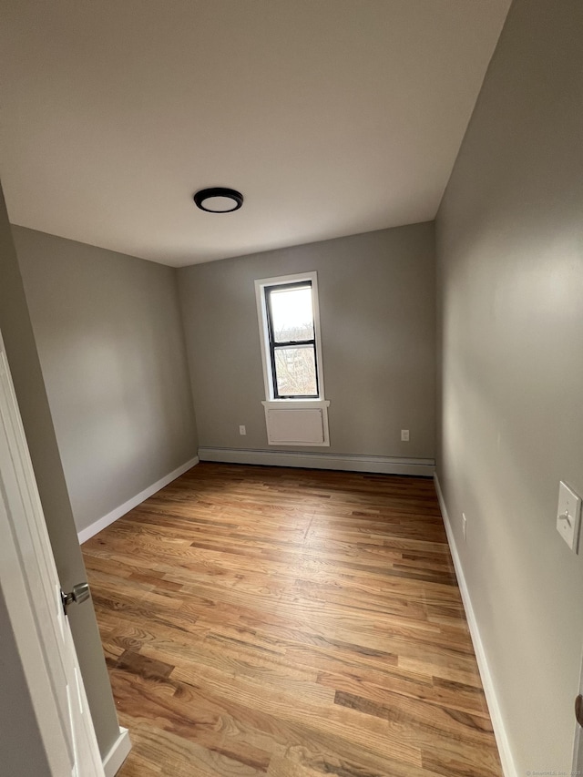 49 Hill St, Waterbury, CT 06704 - unfurnished room with light wood-style flooring and baseboards