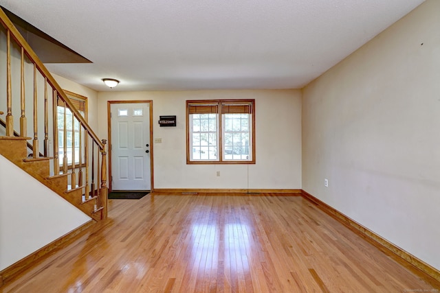 37 White Tail Ln Unit 37, Wallingford, CT 06492 - entryway featuring light wood-type flooring, baseboards, and stairs
