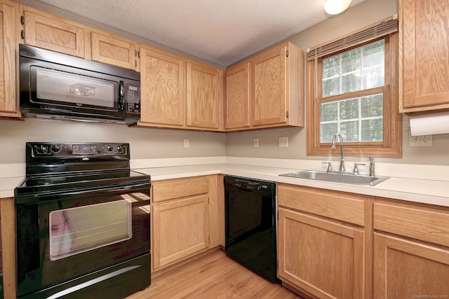 37 White Tail Ln Unit 37, Wallingford, CT 06492 - kitchen with black appliances, light brown cabinets, a sink, and light countertops