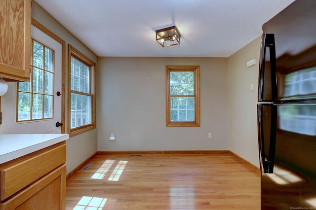 37 White Tail Ln Unit 37, Wallingford, CT 06492 - unfurnished dining area featuring light wood finished floors and baseboards
