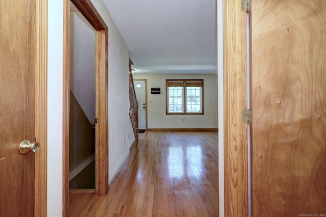 37 White Tail Ln Unit 37, Wallingford, CT 06492 - corridor with wood finished floors, baseboards, and stairway