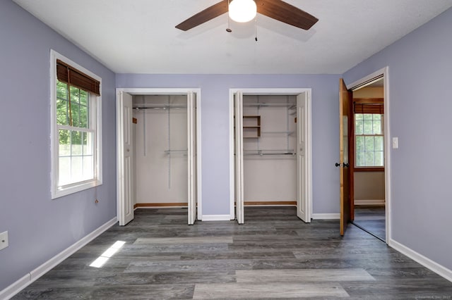 37 White Tail Ln Unit 37, Wallingford, CT 06492 - unfurnished bedroom with two closets, wood finished floors, and baseboards