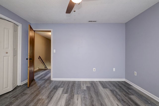 37 White Tail Ln Unit 37, Wallingford, CT 06492 - spare room featuring dark wood-type flooring, a ceiling fan, and baseboards