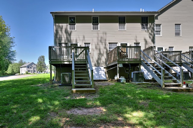 37 White Tail Ln Unit 37, Wallingford, CT 06492 - back of property featuring stairs, a deck, a yard, and cooling unit