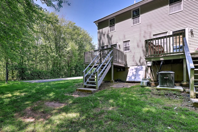 37 White Tail Ln Unit 37, Wallingford, CT 06492 - rear view of property featuring stairway, a deck, a lawn, and central air condition unit