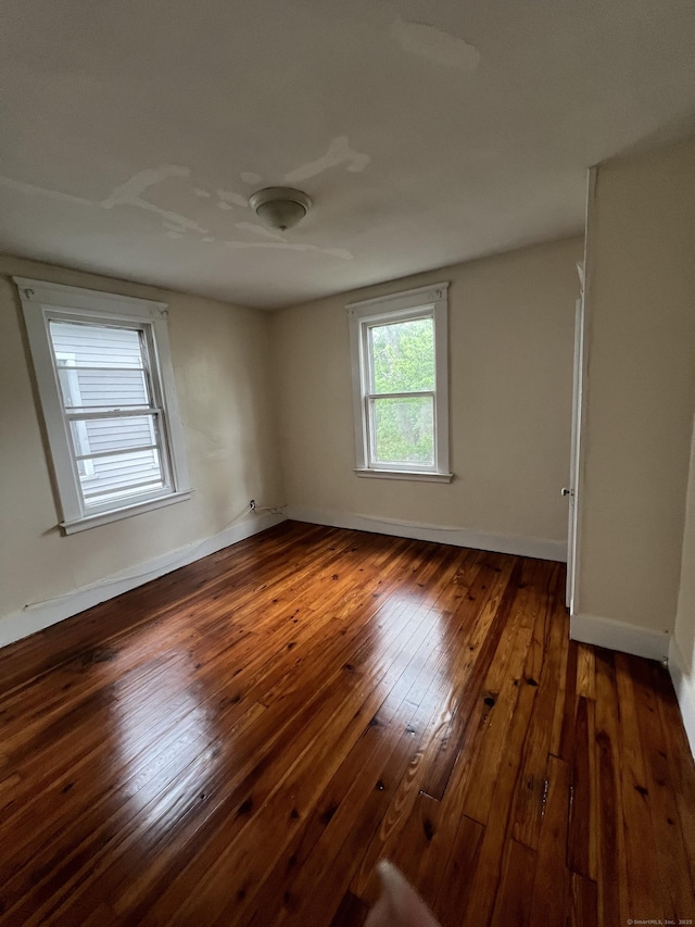 865 Elm St, New Haven, CT 06511 - empty room featuring wood-type flooring and baseboards