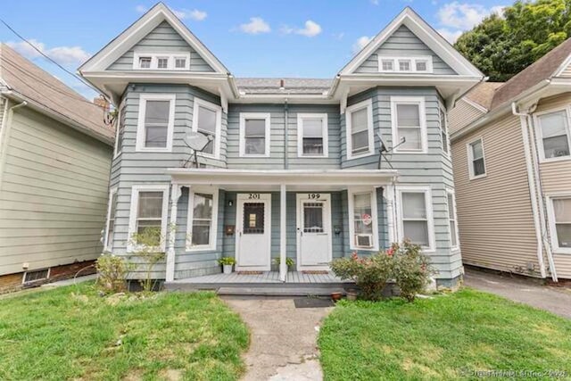 199 Elizabeth St, Derby, CT 06418 - view of front facade with covered porch and a front yard
