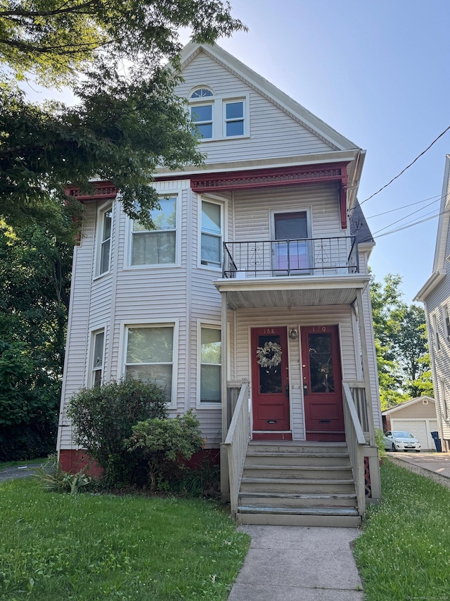 168 Ellsworth Ave, New Haven, CT 06511 - victorian house featuring a balcony, a front yard, and a porch