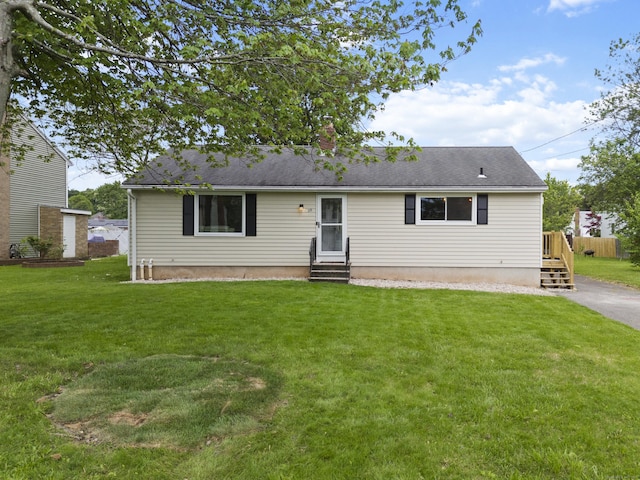 29 Carson Ave, Wethersfield, CT 06109 - view of front facade with entry steps, a front lawn, and a chimney