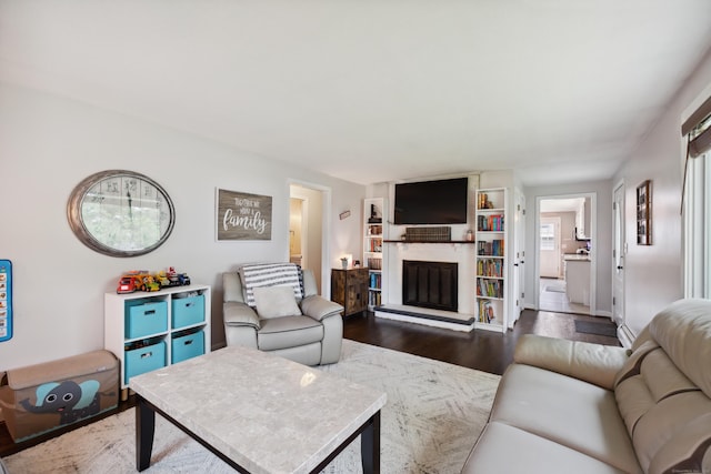 29 Carson Ave, Wethersfield, CT 06109 - living room featuring dark wood finished floors and a large fireplace