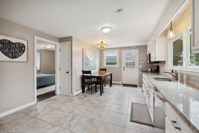 29 Carson Ave, Wethersfield, CT 06109 - kitchen featuring stainless steel appliances, a sink, white cabinetry, baseboards, and light stone countertops