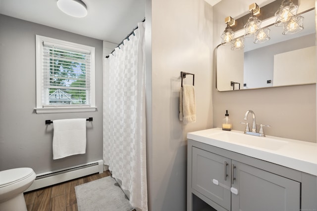 29 Carson Ave, Wethersfield, CT 06109 - full bath with a baseboard radiator, vanity, wood finished floors, toilet, and curtained shower