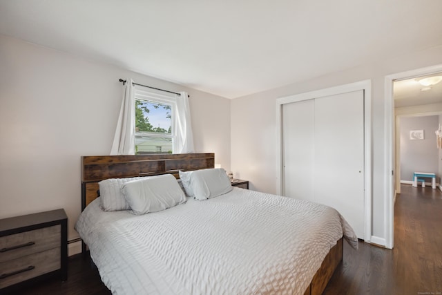 29 Carson Ave, Wethersfield, CT 06109 - bedroom with a closet, dark wood-style floors, a baseboard heating unit, and baseboards