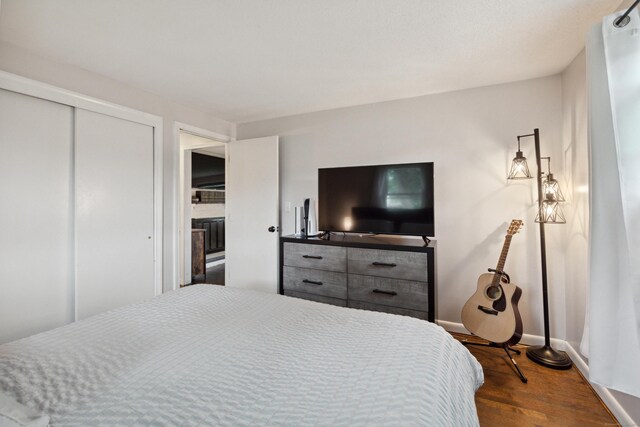 29 Carson Ave, Wethersfield, CT 06109 - bedroom with dark wood-style floors, a closet, and baseboards