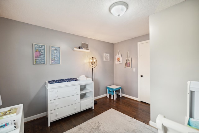 29 Carson Ave, Wethersfield, CT 06109 - bedroom with wood finished floors, baseboards, and a textured ceiling