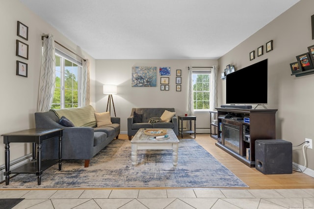 167 Santa Maria Dr, Torrington, CT 06790 - living room with tile patterned flooring and baseboards