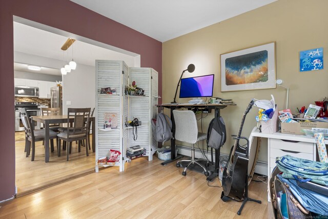 167 Santa Maria Dr, Torrington, CT 06790 - office with light wood finished floors and a baseboard radiator