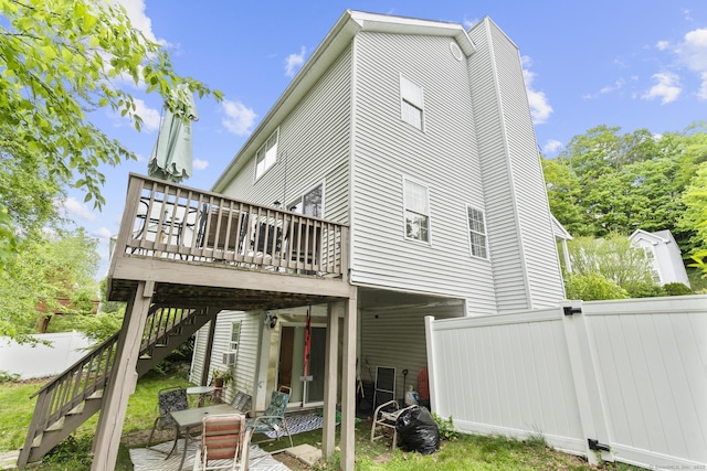 167 Santa Maria Dr, Torrington, CT 06790 - back of property featuring a deck, stairs, and a chimney