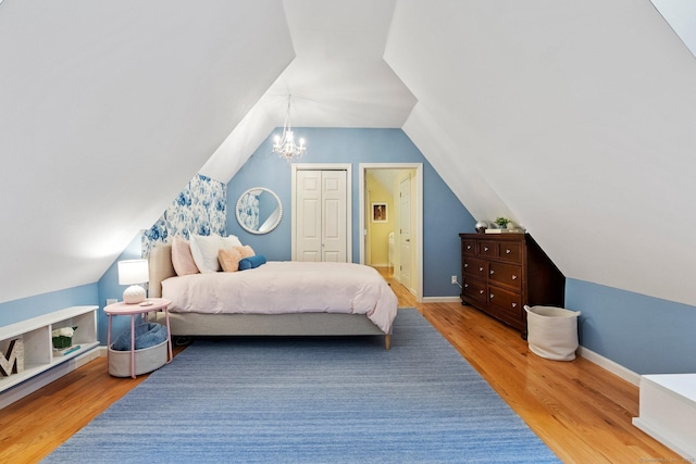 27 Chiltern St, Farmington, CT 06032 - bedroom featuring lofted ceiling, wood finished floors, a chandelier, baseboards, and ensuite bath