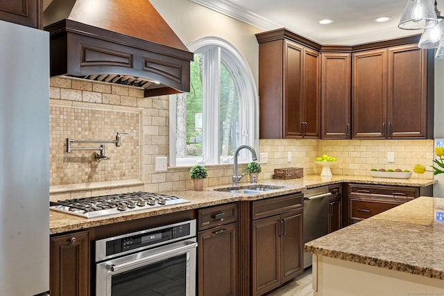 27 Chiltern St, Farmington, CT 06032 - kitchen with stainless steel appliances, a sink, ornamental molding, backsplash, and light stone counters