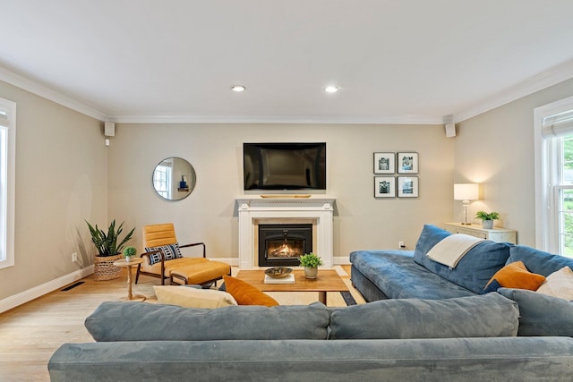 27 Chiltern St, Farmington, CT 06032 - living area with wood finished floors, ornamental molding, a glass covered fireplace, baseboards, and recessed lighting