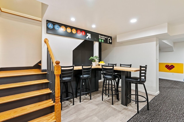 27 Chiltern St, Farmington, CT 06032 - dining area featuring recessed lighting, bar area, baseboards, and stairs