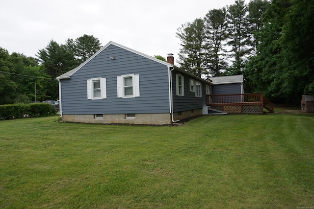 5 Chappell St, Chaplin, CT 06235 - view of side of home featuring a deck, a chimney, and a yard