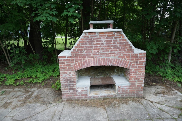 5 Chappell St, Chaplin, CT 06235 - detailed view of an outdoor brick fireplace