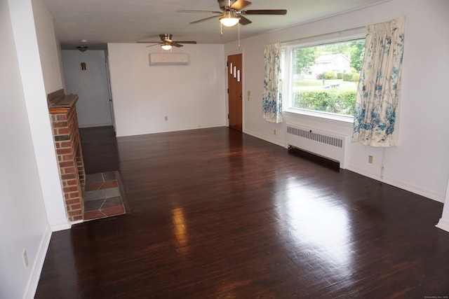 5 Chappell St, Chaplin, CT 06235 - empty room with radiator, a wall unit AC, a ceiling fan, wood finished floors, and baseboards