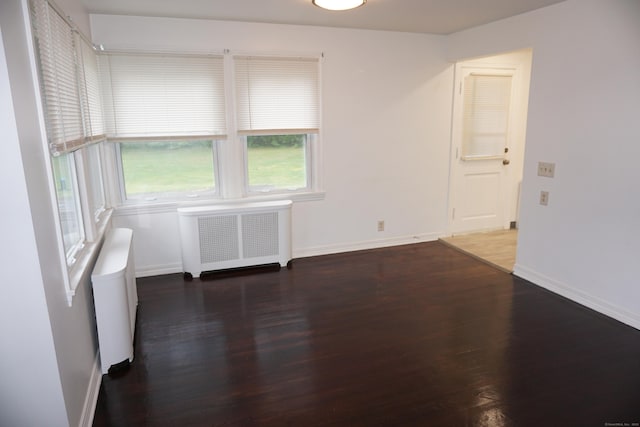 5 Chappell St, Chaplin, CT 06235 - spare room with radiator heating unit, wood finished floors, and baseboards