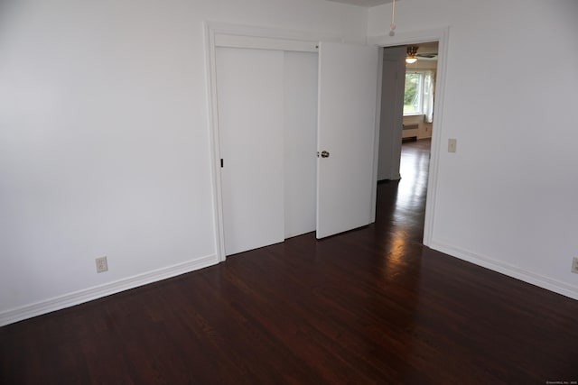 5 Chappell St, Chaplin, CT 06235 - unfurnished bedroom featuring dark wood-type flooring, a closet, and baseboards