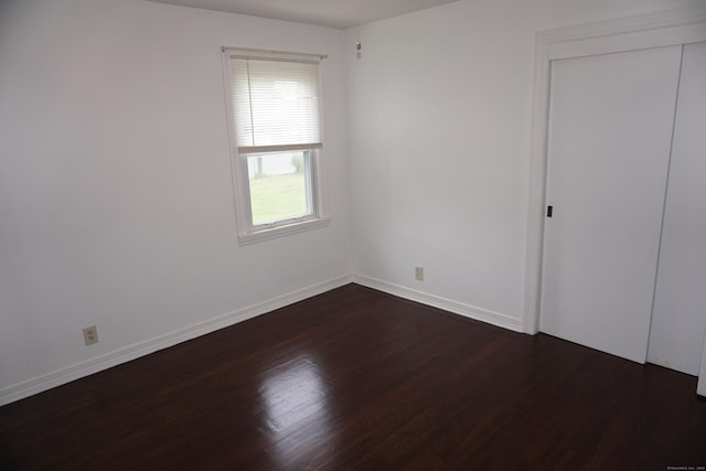 5 Chappell St, Chaplin, CT 06235 - unfurnished bedroom featuring dark wood-type flooring, baseboards, and a closet