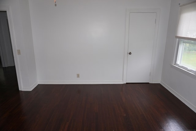 5 Chappell St, Chaplin, CT 06235 - empty room with dark wood-style floors and baseboards