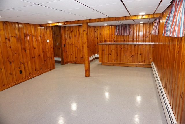 5 Chappell St, Chaplin, CT 06235 - bar area featuring a baseboard heating unit, tile patterned floors, a drop ceiling, and wood walls