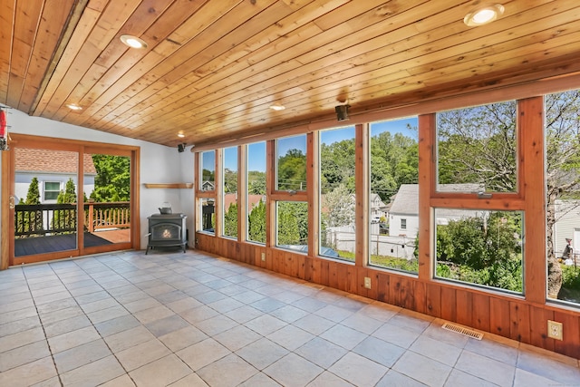 309 Marlborough Ter, Fairfield, CT 06825 - unfurnished sunroom featuring a wood stove