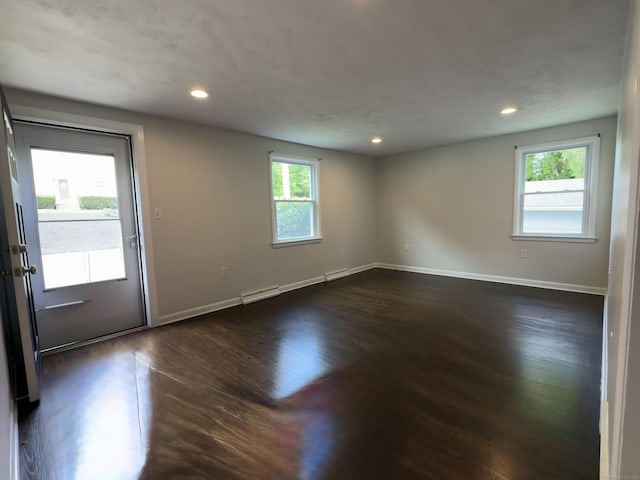 10 Bozrah St, Bozrah, CT 06334 - spare room with a baseboard heating unit, baseboards, dark wood-type flooring, and recessed lighting