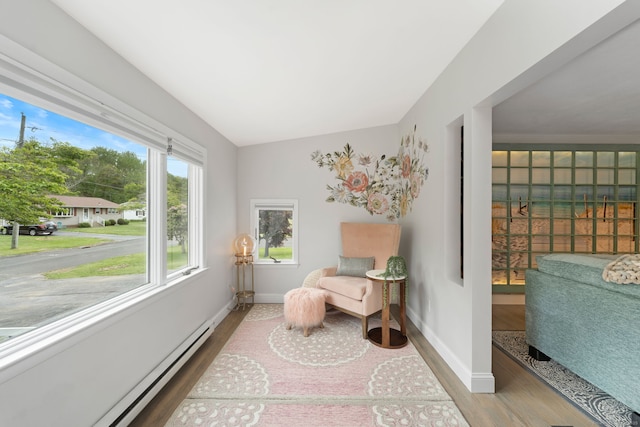 6 Meadow Dr, Waterford, CT 06385 - living area with wood finished floors, baseboards, and a baseboard radiator