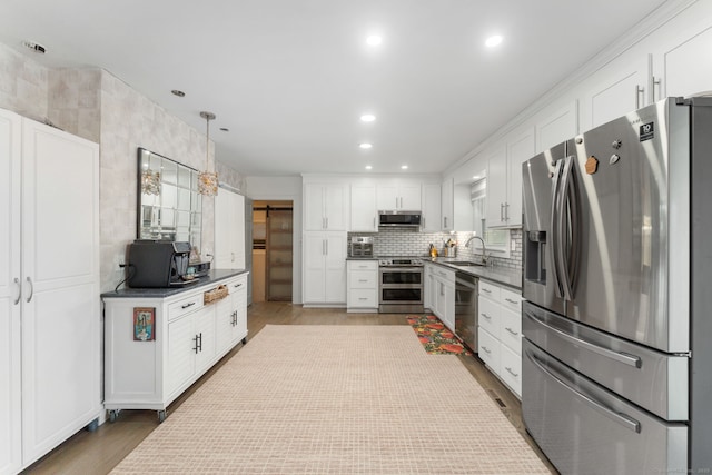 6 Meadow Dr, Waterford, CT 06385 - kitchen featuring stainless steel appliances, white cabinets, tasteful backsplash, dark countertops, and recessed lighting