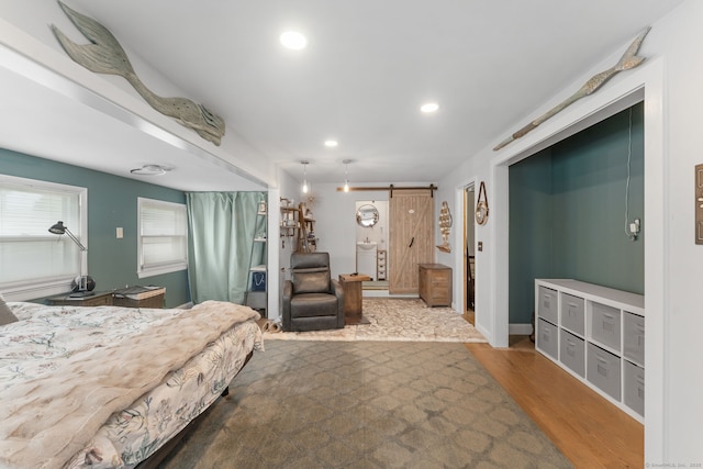 6 Meadow Dr, Waterford, CT 06385 - bedroom featuring wood finished floors, recessed lighting, and a barn door