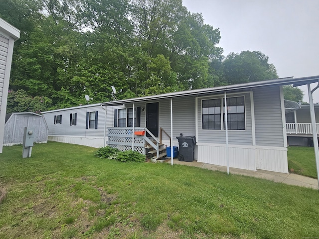 210 Bundy Hill Rd Lot 14, Lisbon, CT 06351 - manufactured / mobile home featuring a front lawn and a porch