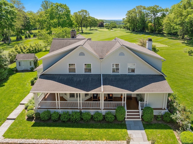 145 Seir Hill Rd, Wilton, CT 06897 - view of front facade with a chimney, covered porch, a front yard, and a shingled roof