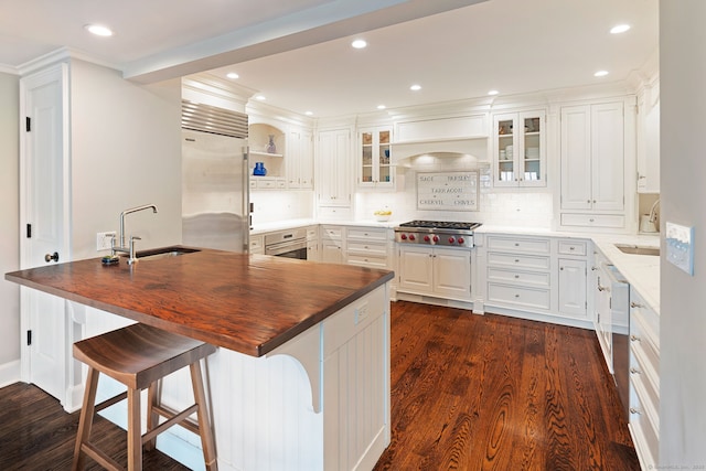 145 Seir Hill Rd, Wilton, CT 06897 - kitchen with a sink, stainless steel appliances, wooden counters, a peninsula, and recessed lighting