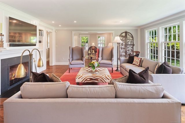 145 Seir Hill Rd, Wilton, CT 06897 - living room featuring wood finished floors, crown molding, a lit fireplace, baseboards, and recessed lighting