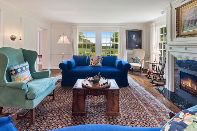 145 Seir Hill Rd, Wilton, CT 06897 - living area with a decorative wall, a premium fireplace, crown molding, and wood finished floors