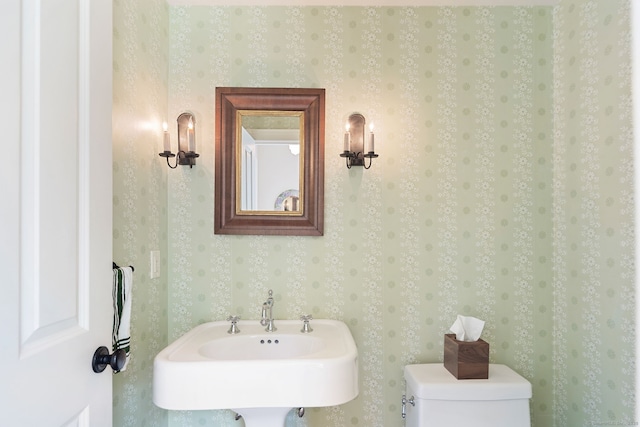 145 Seir Hill Rd, Wilton, CT 06897 - bathroom with wallpapered walls, toilet, and a sink