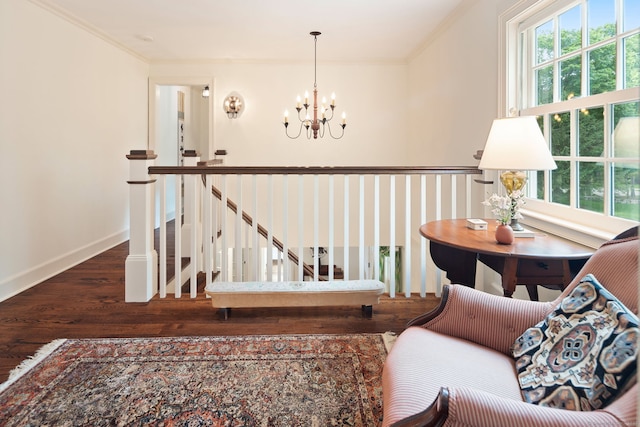 145 Seir Hill Rd, Wilton, CT 06897 - living area featuring a chandelier, ornamental molding, wood finished floors, an upstairs landing, and baseboards