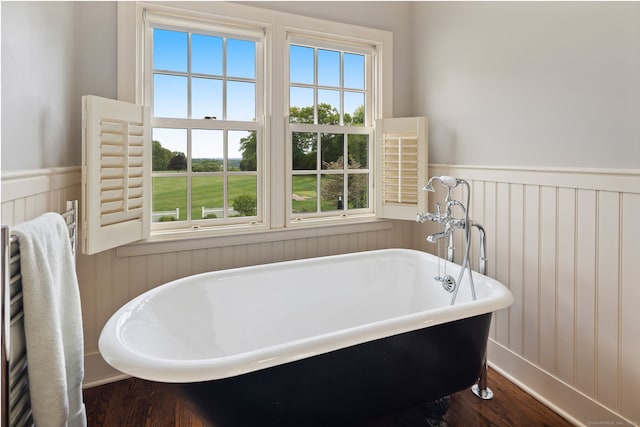 145 Seir Hill Rd, Wilton, CT 06897 - full bath with a wainscoted wall, a freestanding tub, wood finished floors, and healthy amount of natural light